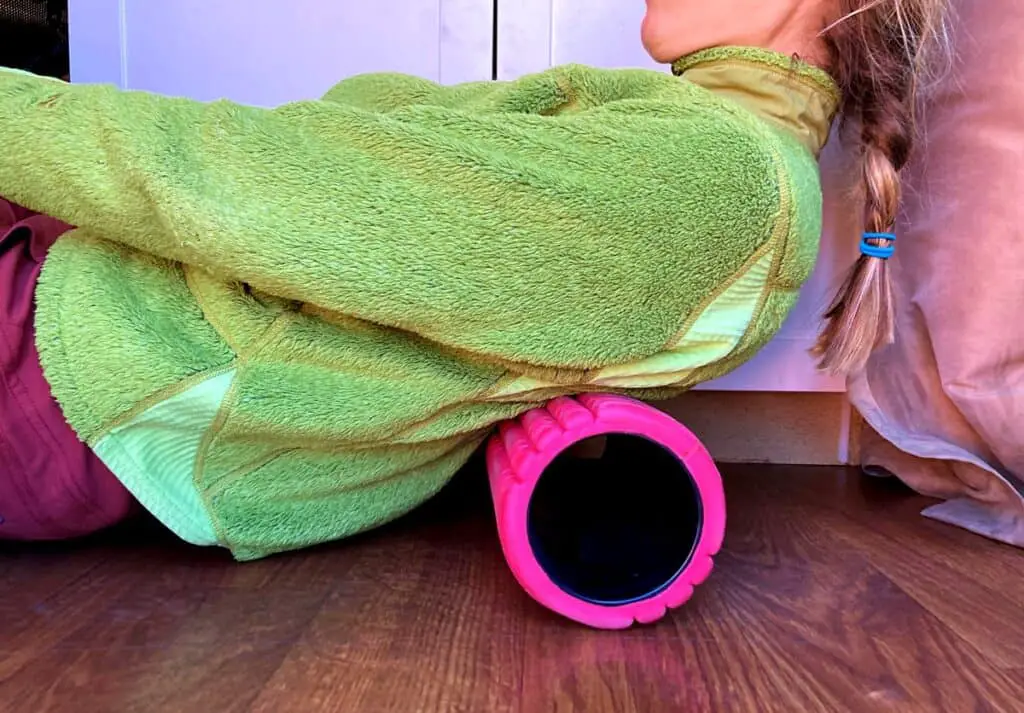 Lady in Lime Green Sweater On A Pink Foam Roller