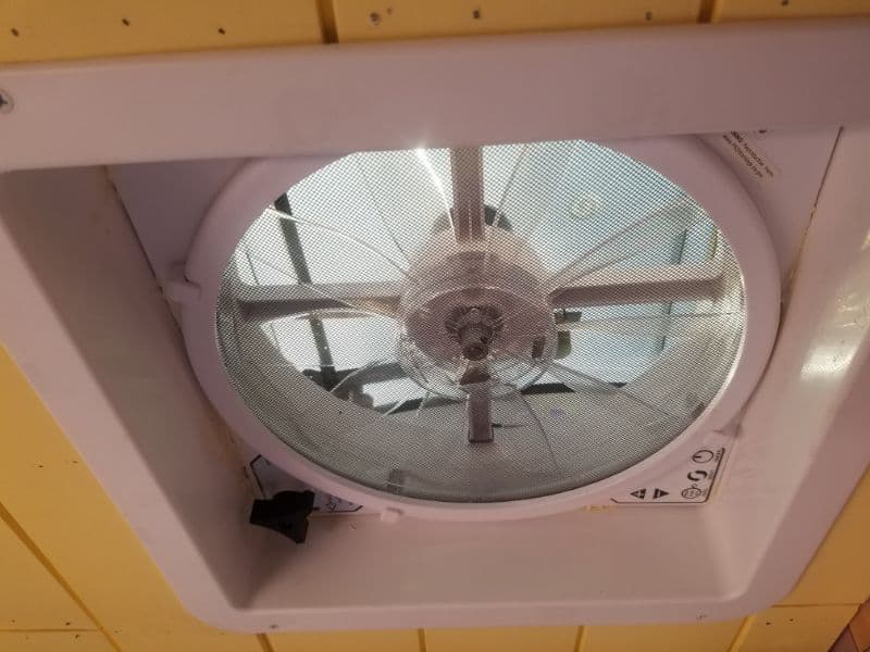 ceiling fan installed in conversion van ceiling